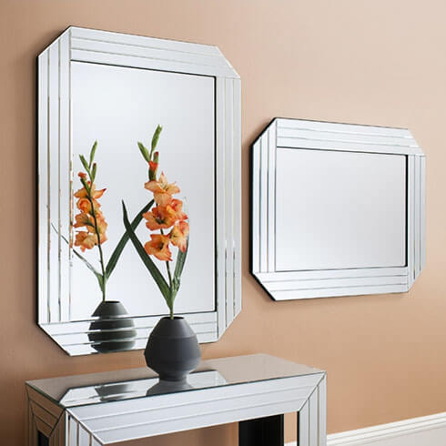 art deco style mirrored furniture, wall mirror and flowers in vase