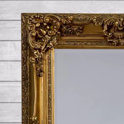 close up of gold framed ornate baroque mirror