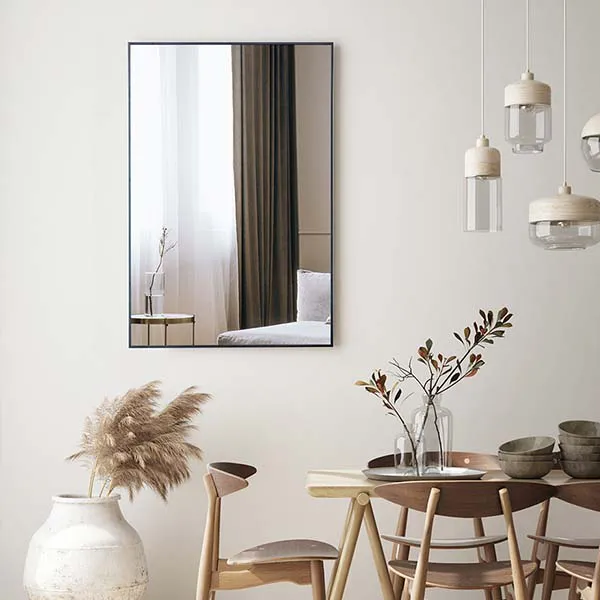 dining room and lounge mirrors - minimal black framed rectangle mirror over table