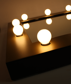 Vanity mirror with lightbulbs similar to Black Swan mirrors
