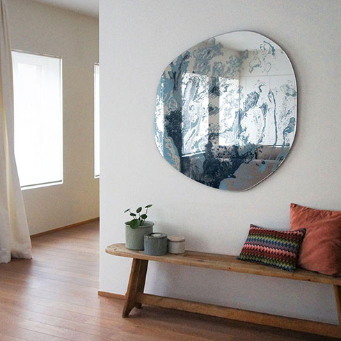 contemporary shaped abstract printed mirror in living room