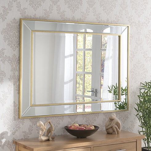 simple gold edged mirror art deco style on wall
