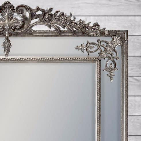 silver guilded ornate framed mirror